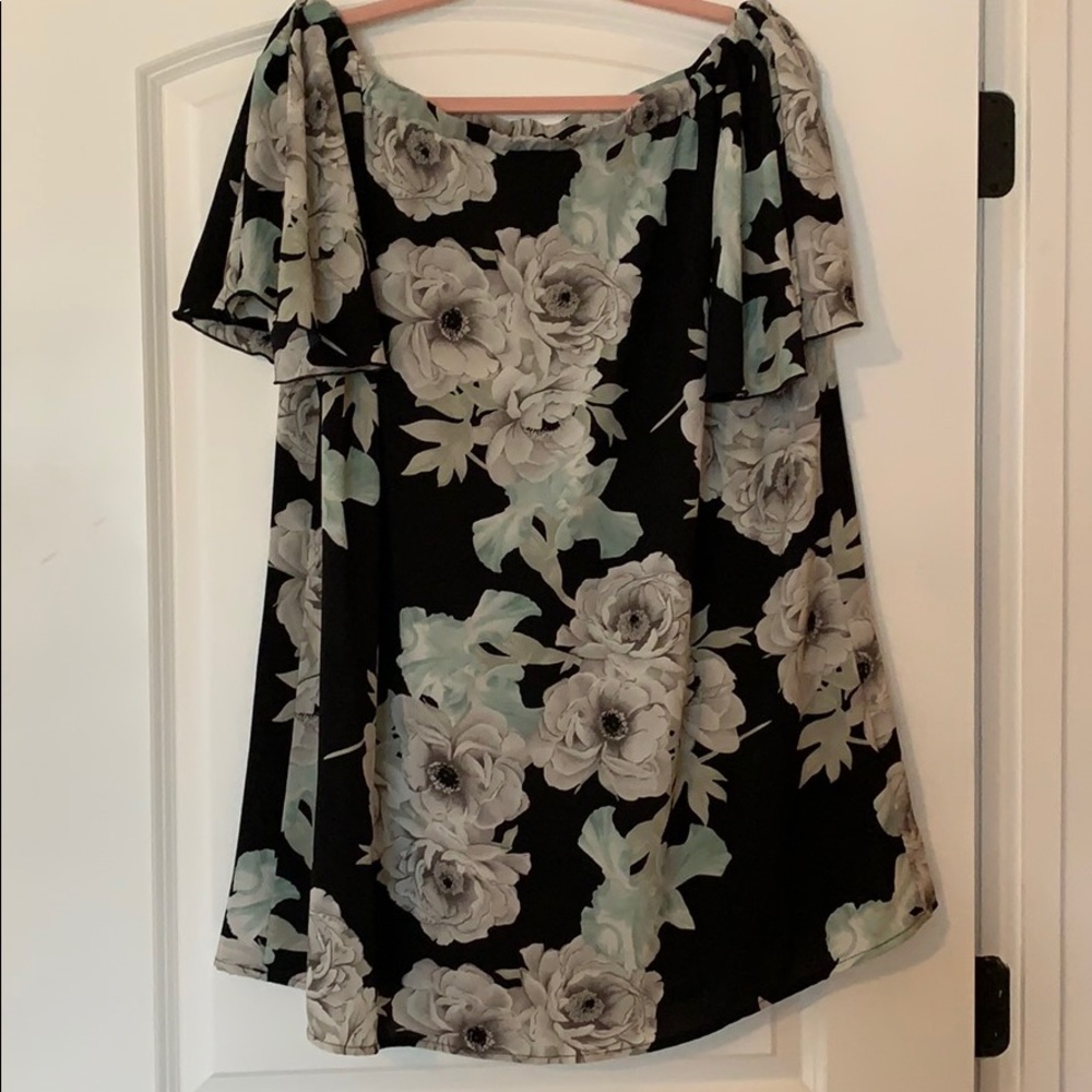 Elegant black off the shoulder dress.